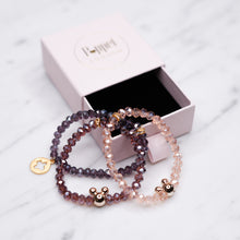 Load image into Gallery viewer, pink mauve plum purple crystal rondelle sparkling bead bracelets ab shimmer gold acrylic mickey mouse bead 24k matte gold plated clover charm in poppet london jewellery box gift box on marble great presents for girls and women friends and family
