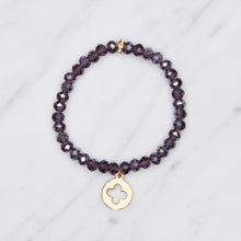 Load image into Gallery viewer, plum purple dark ab shimmer rondelle crystal beads elastic stretch bracelet with clover cross 24K matte gold charm on marble
