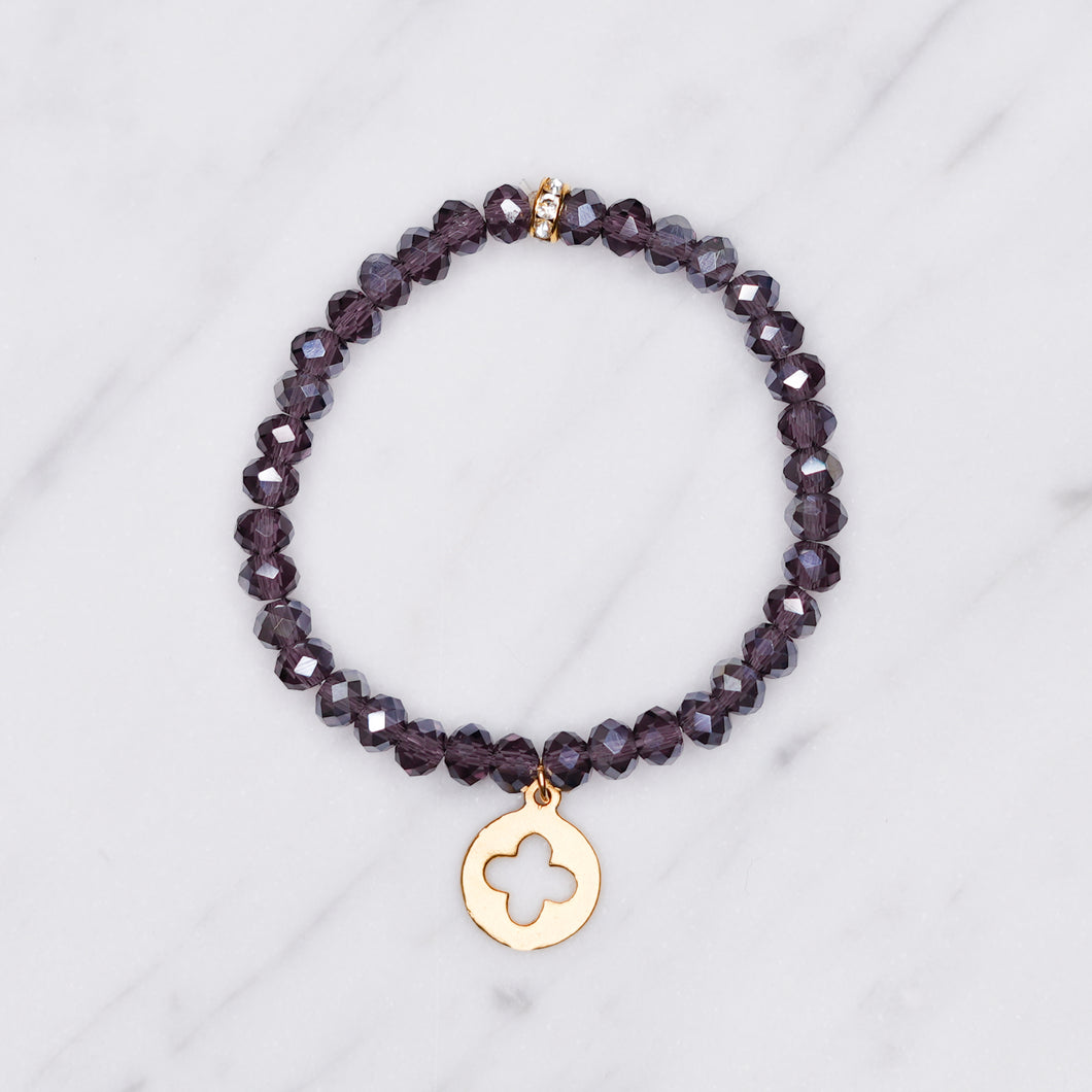 plum purple dark ab shimmer rondelle crystal beads elastic stretch bracelet with clover cross 24K matte gold charm on marble